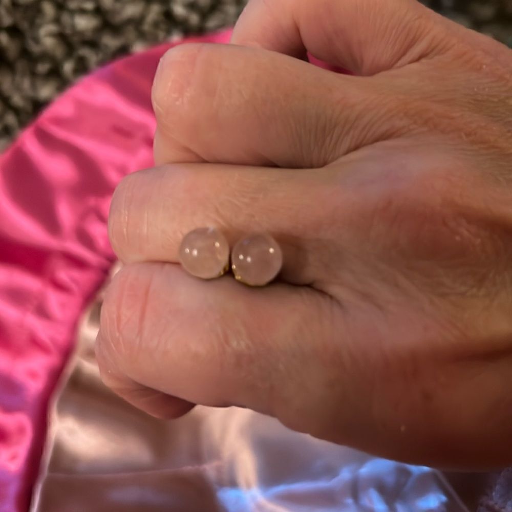 Avon light pink pierced ball earrings.